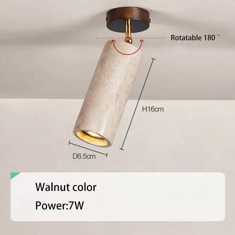 A decorbites led natural spotlight featuring a cylindrical textured concrete light with walnut wood base and brass accents