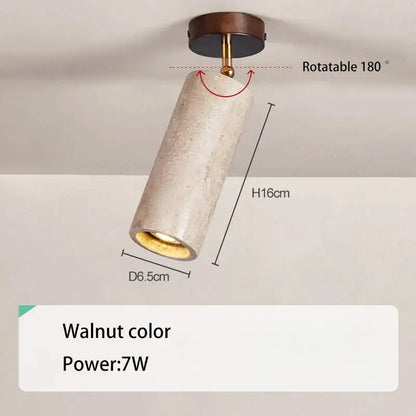 A decorbites led natural spotlight featuring a cylindrical textured concrete light with walnut wood base and brass accents