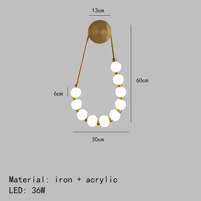 Gold-toned decorbites led necklace wall light with seven white acrylic bulbs on black metal arms for home art deco decor