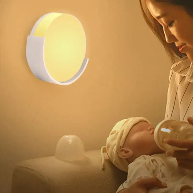 A modern decorbites led night light with a white plastic frame and warm yellow led light for bedroom use