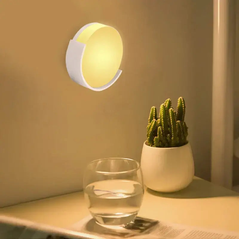 A sleek decorbites led night light with white casing and warm yellow glow for baby bedroom and living room use