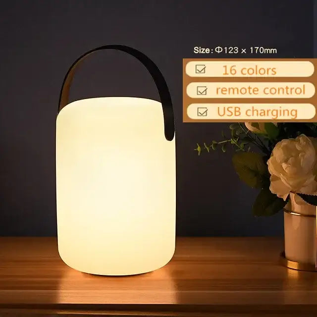 A sleek white cylindrical led night light with usb charging and a black handle from decorbites for home and outdoor use