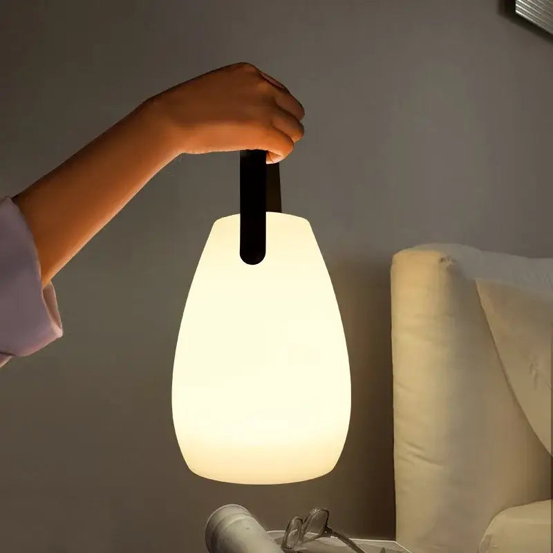 Decorbites™ led night light is a soft glowing white pendant lamp with sleek black handle portable for home and outdoors