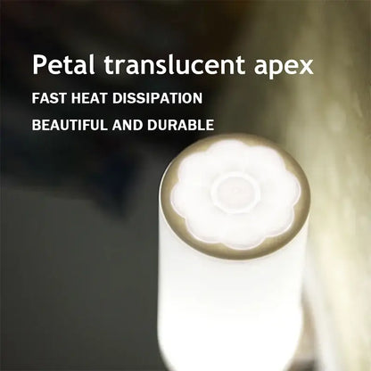 A white petal-shaped translucent apex with a gold rim on the decorbites led night light for bedroom use