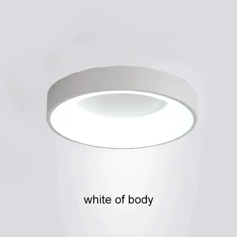 White cylindrical light fixture with a circular ring of leds around the top.
