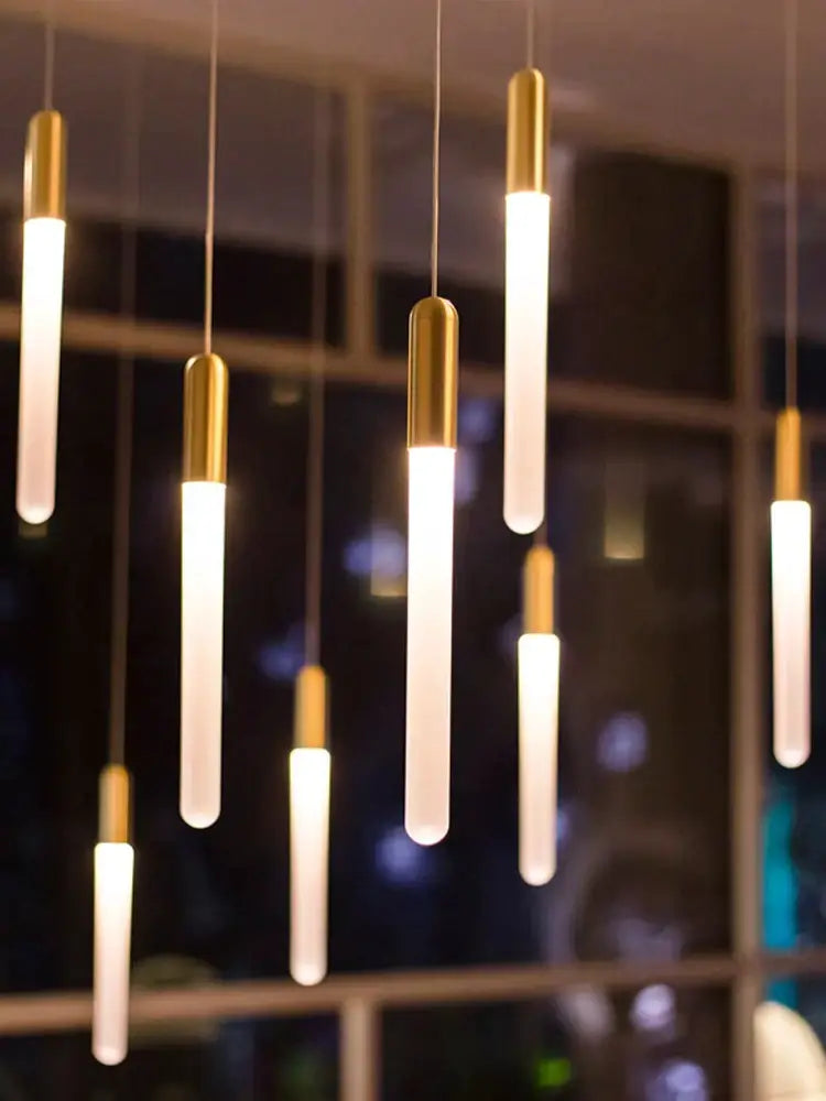 Modern pendant lights with sleek gold caps and frosted glass tubes in decorbites led nordic cylinder chandelier