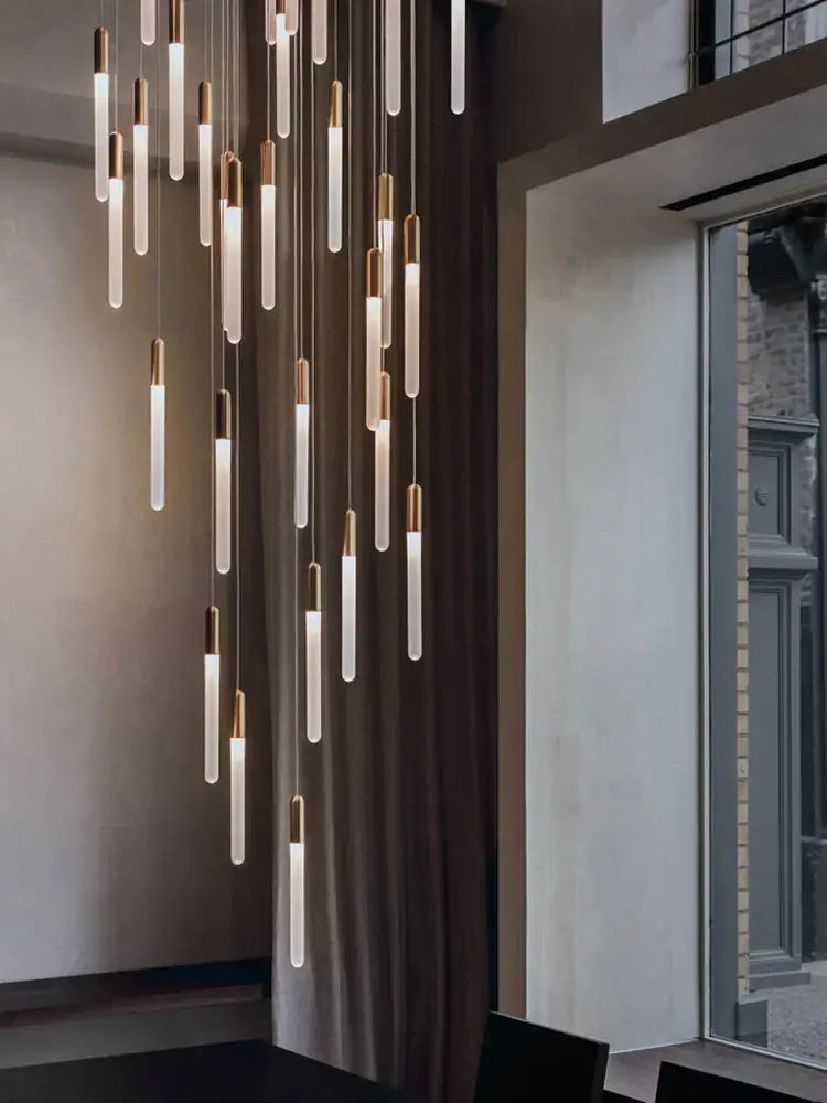 Modern pendant nordic cylinder chandelier with translucent glass tubes and polished brass accents by decorbites led nordic