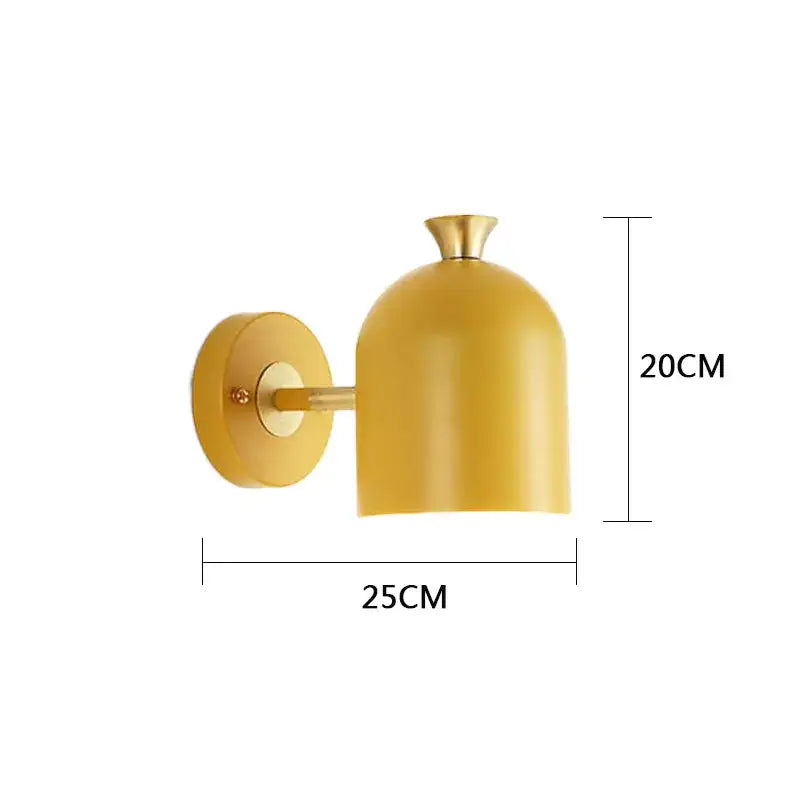 A sleek mustard-yellow decorbites led nordic wall lamp with a rounded dome shade and brass-finished arm for indoor use