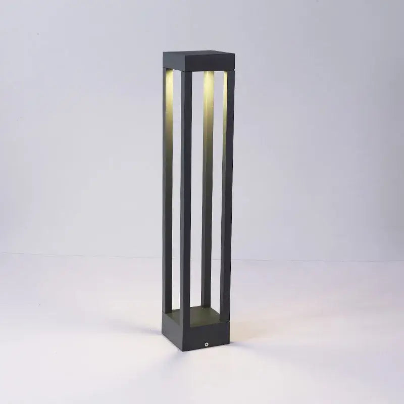DecorBites™ led outdoor black rectangular pathway light with vertical slats and warm led illumination for lawn lighting