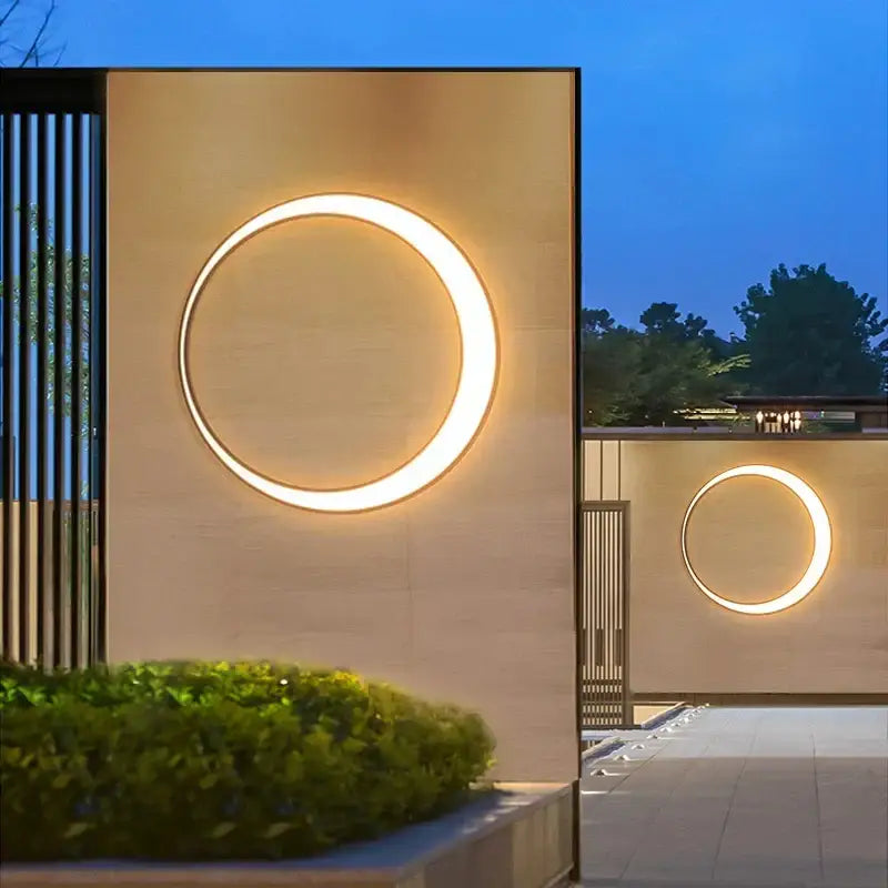 Warm circular DecorBites LED outdoor wall lamp with modern minimalist design for courtyard and balcony lighting