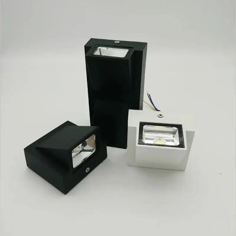 Black and white rectangular DecorBites LED outdoor wall light with sleek modern design for LED outdoor porch use