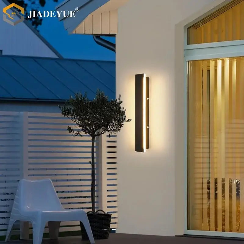 Modern black rectangular DecorBites™ LED outdoor wall lamp with sleek minimalist design and warm lighting for balcony garden porch