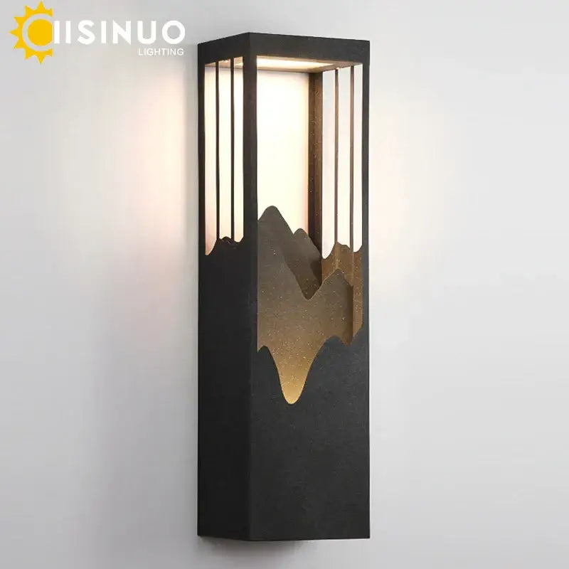 Black rectangular decorbites led outdoor wall lamp with gold mountain silhouette and vertical slats for garden lighting