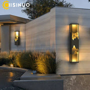 DecorBites led outdoor wall lamp with sleek black frame and golden mountain design emitting warm ambient light for garden use