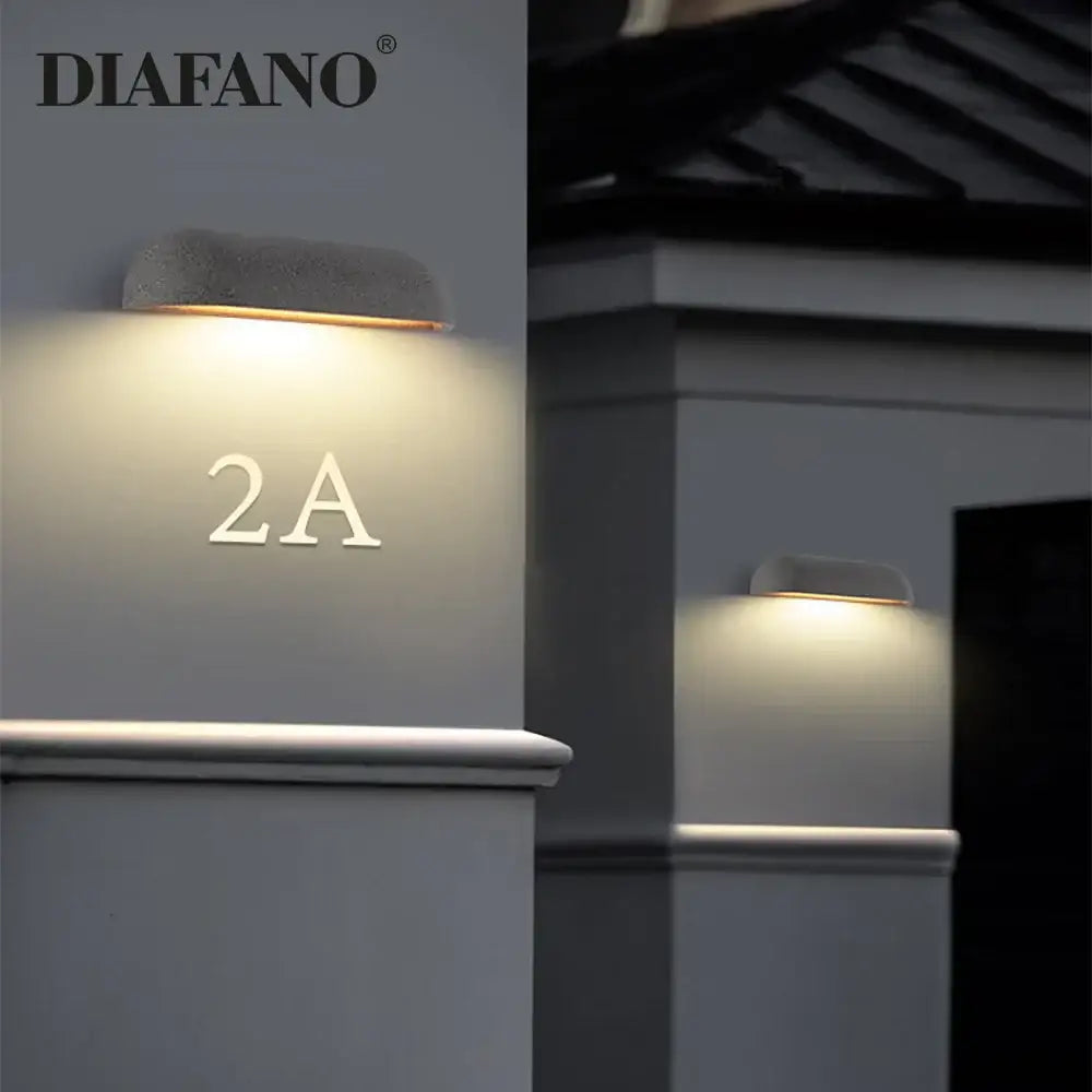 Diafano decorbites led outdoor wall lamp with textured gray concrete finish and warm white light for japanese garden decor