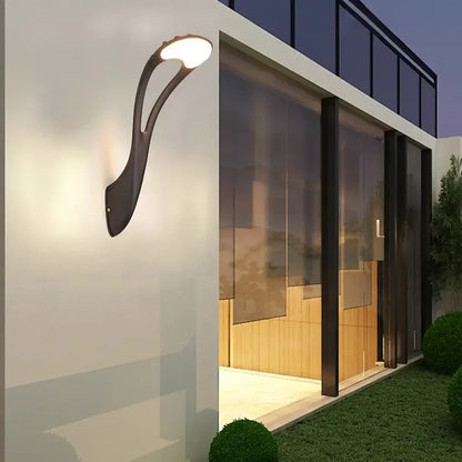 Modern black DecorBites™ outdoor wall lamp with sleek curved design and warm white LED light for garden and balcony