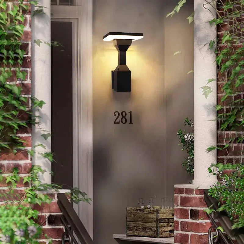 Black modern wall lamp decorbites™ with rectangular flat-panel design and warm illumination for outdoor wall use