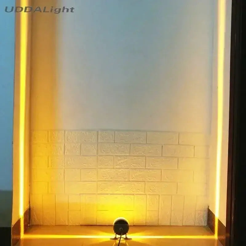 Decorbites™ led outdoor wall lamp with warm yellow strip lights and spotlight framing a textured white brick wall
