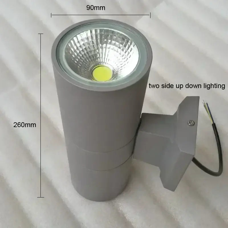 Gray cylindrical decorbites™ led outdoor wall lamp with dual-directional lighting and waterproof design for porch use