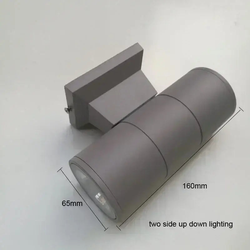 DecorBites™ gray cylindrical outdoor wall lamp with matte finish and dual-directional LED lighting for porch use