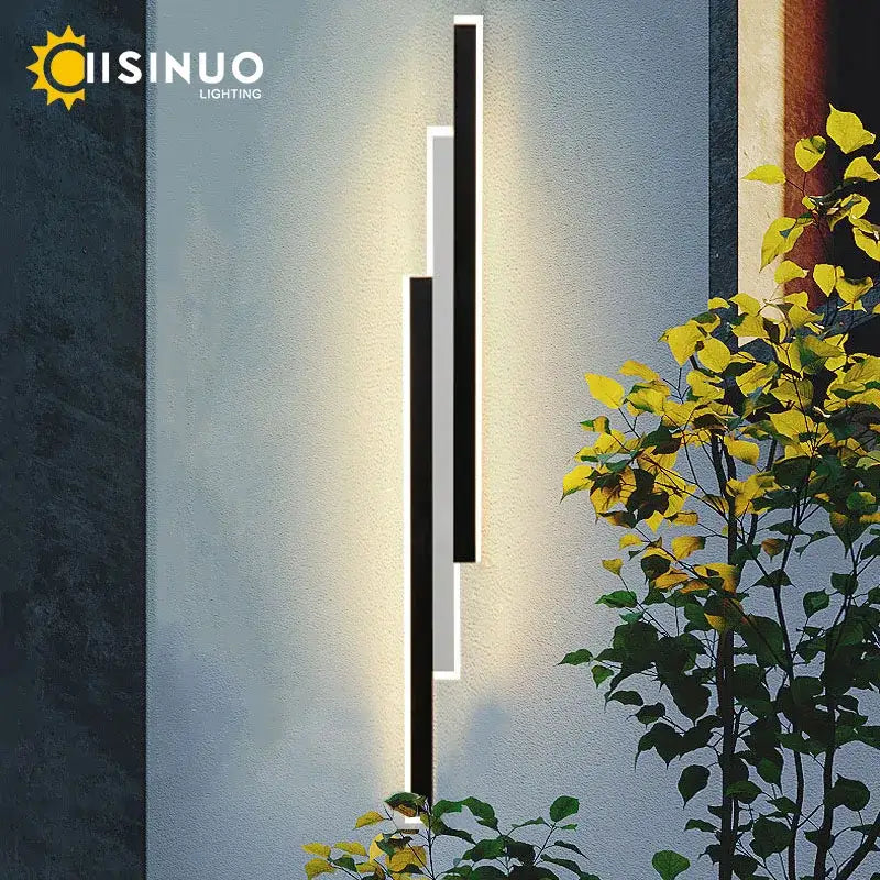 Modern minimalist decorbites led outdoor wall lantern with sleek black and white bars emits warm ambient glow