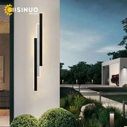 Modern minimalist decorbites led outdoor wall lantern with black and white bars emitting warm glow for porch lighting
