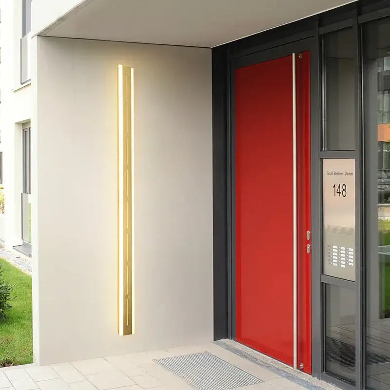 Gold-toned vertical decorbites led outdoor wall light with sleek modern design for garden porch use IP65 rated