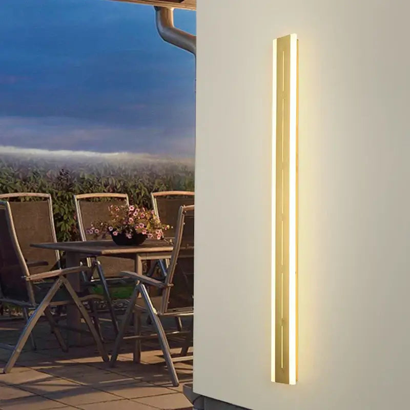 Gold-toned rectangular DecorBites LED outdoor wall light with sleek modern design for garden and porch lighting