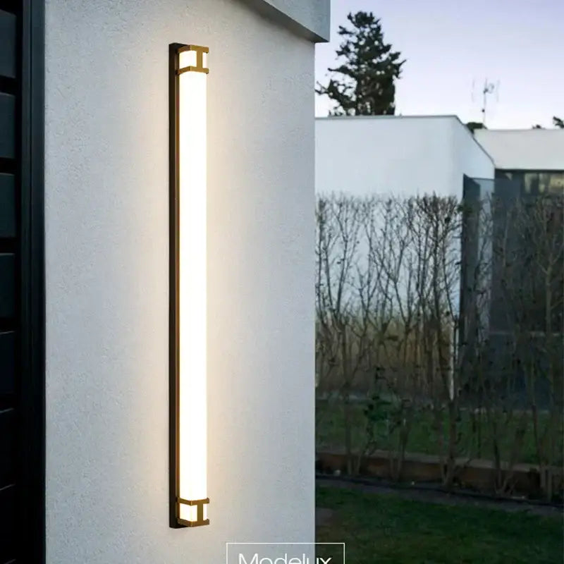 Modern gold-toned decorbites led outdoor wall lamp with sleek rectangular design and warm illumination for garden use
