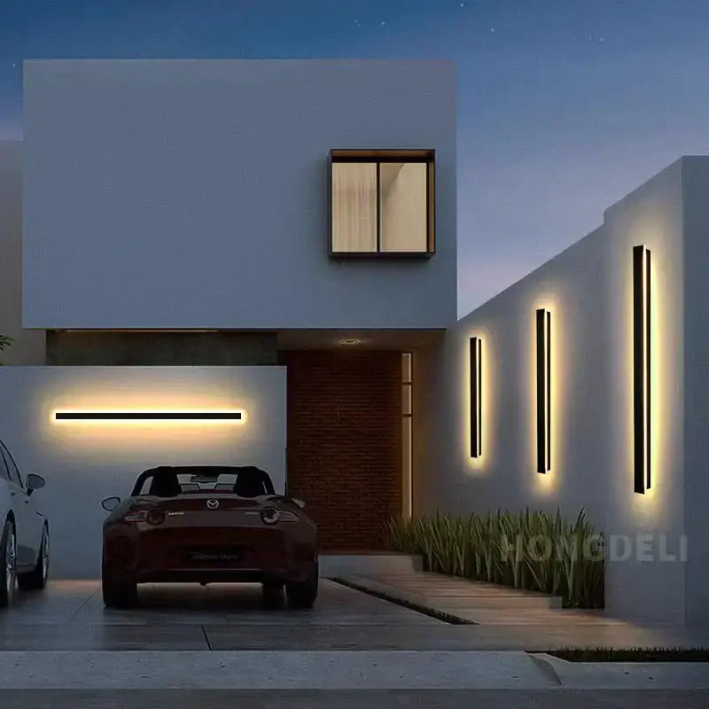 Decorbites led outdoor wall light in waterproof aluminum mounted on a white modern house with a maroon mazda mx-5 miata