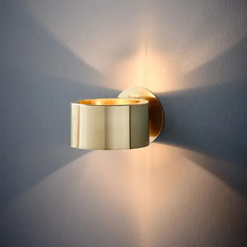 Brass decorbites led outdoor wall light with sleek cylindrical design and warm ambient lighting for indoor use