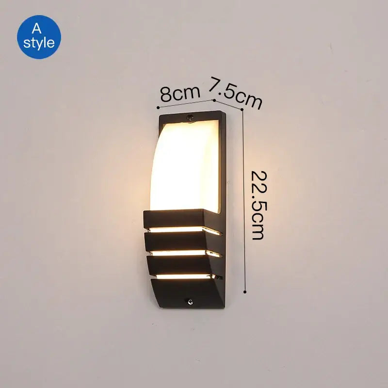 Black DecorBites led outdoor wall sconce with rectangular curved light panel and three horizontal slats for outdoor wall use