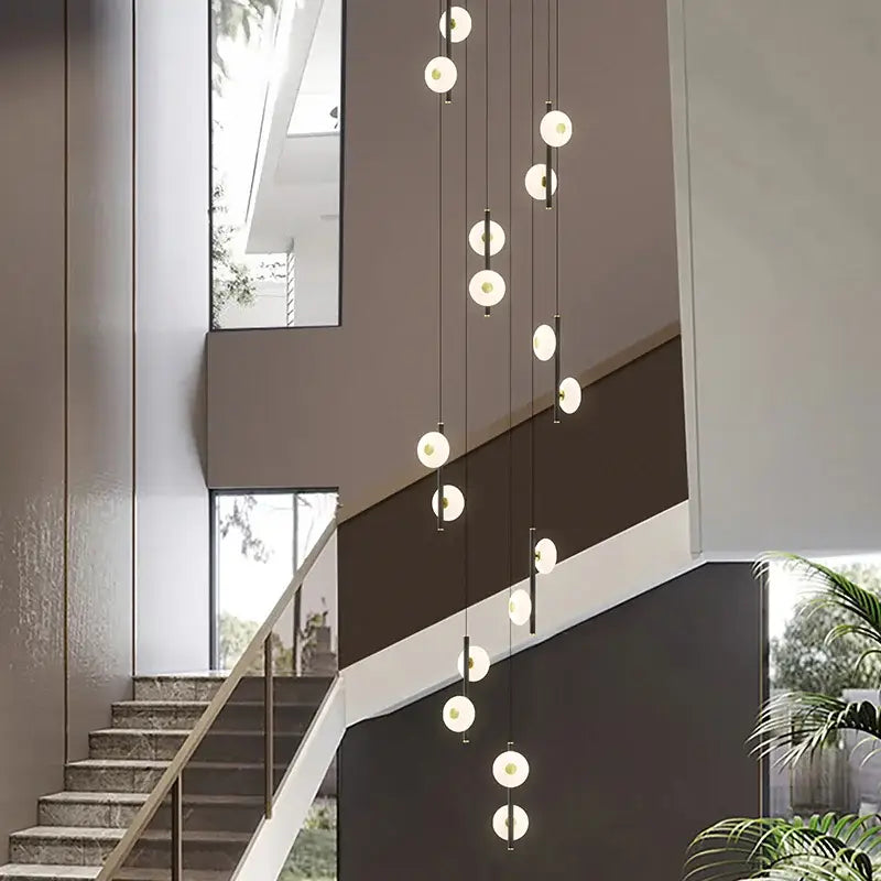 Modern minimalist decorbites led oval chandelier with spherical frosted glass globes and black cords for indoor lighting