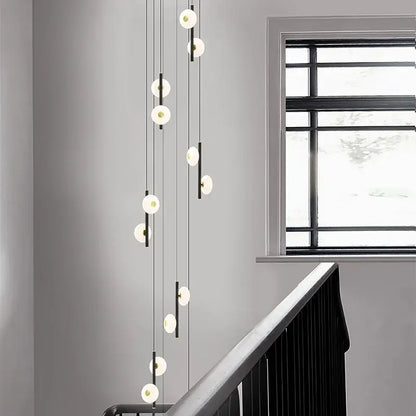 Modern minimalist decorbites led oval chandelier with spherical white glass globes and thin black cords for indoor lighting