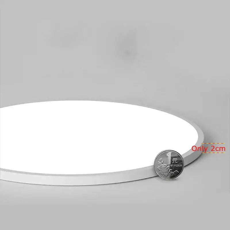 A sleek minimalist white circular decorbites led panel ceiling light with a thin profile for home lighting