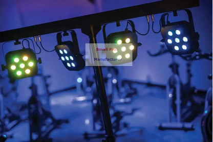 Three black led par stage lights with bright green and blue bulbs suspended from a metal rig in decorbites led par kit