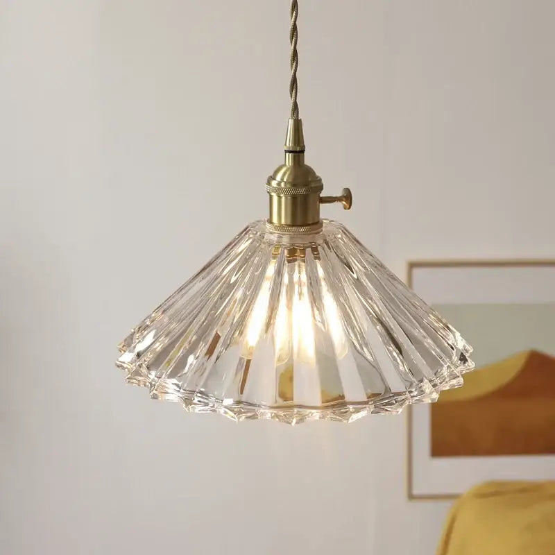 Decorbites led pendant lamp with clear faceted glass, brass fixture, and twisted cord for modern stair lighting