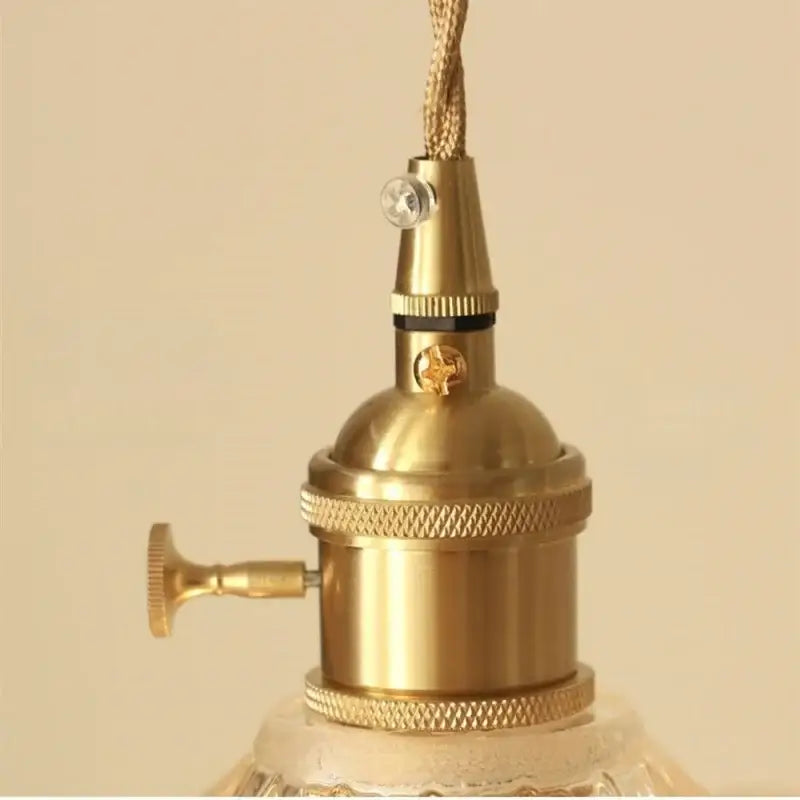 Brass-finished vintage-style lamp socket with textured ridged bands and decorative knob for decorbites led pendant lamp