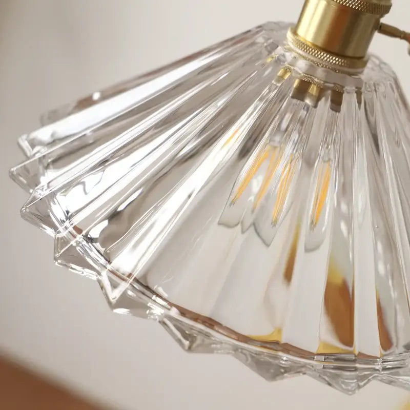 DecorBites™ LED pendant lamp featuring a clear faceted glass lampshade with brass-finished metal fixture