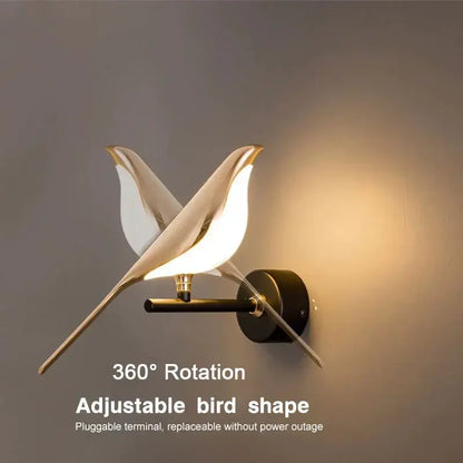 Modern gold-toned led pendant lamp by decorbites shaped like two stylized birds with minimalist wall sconce design