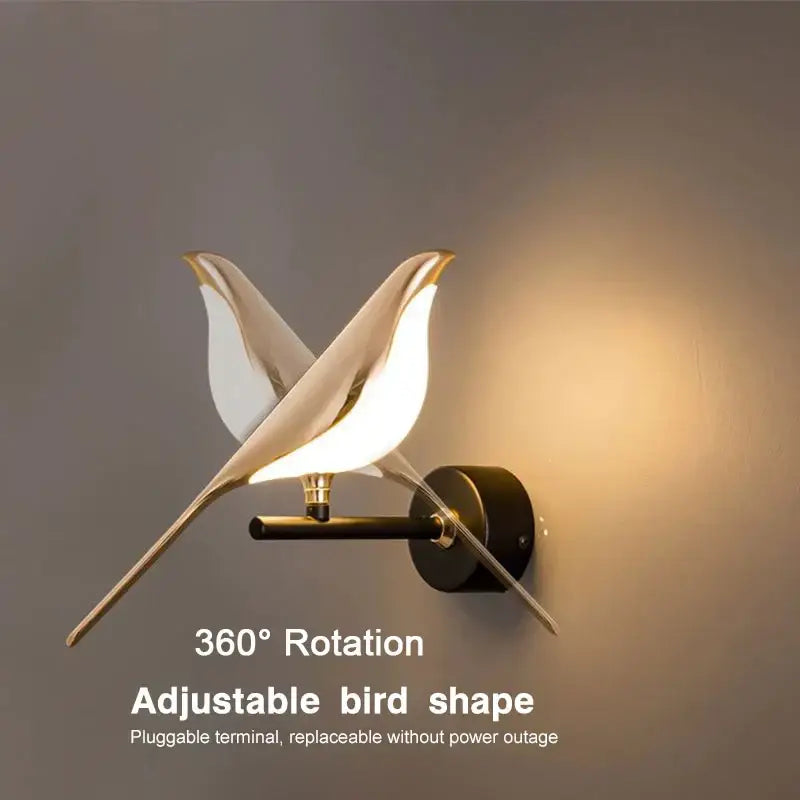 Modern gold-toned led pendant lamp by decorbites shaped like two stylized birds with minimalist wall sconce design