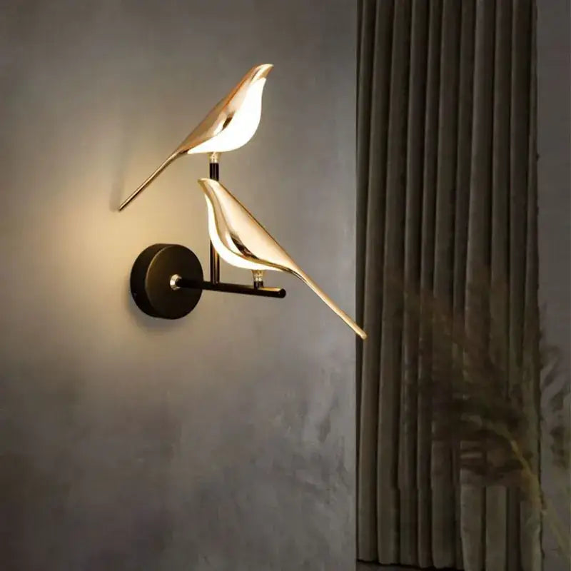 Gold-toned bird-shaped led pendant lamp with sleek minimalist design and warm glow for bedroom interior decor