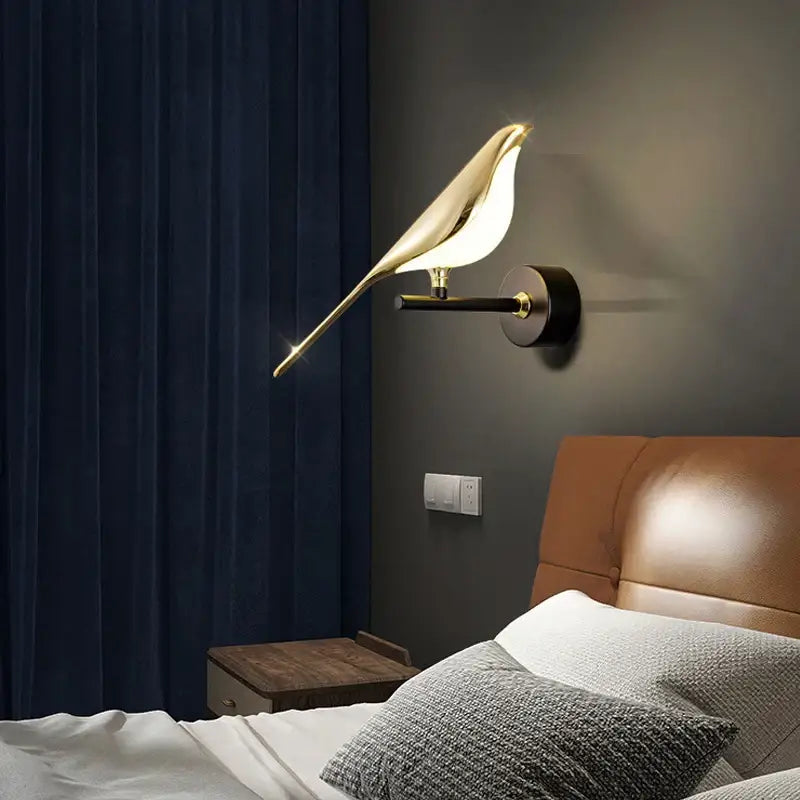Gold-toned bird-shaped led pendant lamp with sleek modern design and smooth metallic finish for bedroom interior