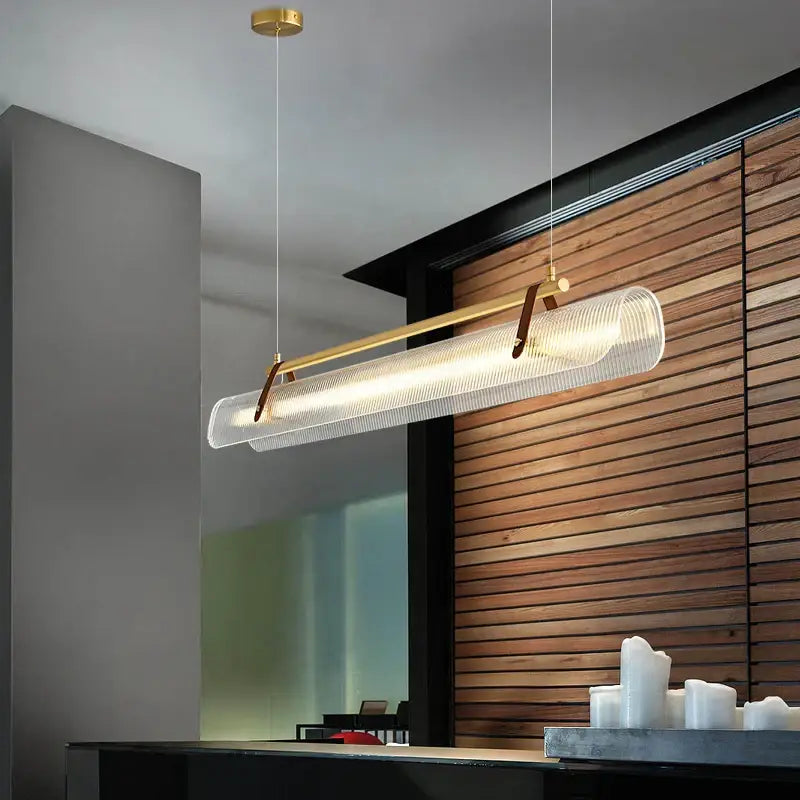 Modern minimalist decorbites led pendant lamp with translucent ribbed glass, brass frame, and leather accents for dining room