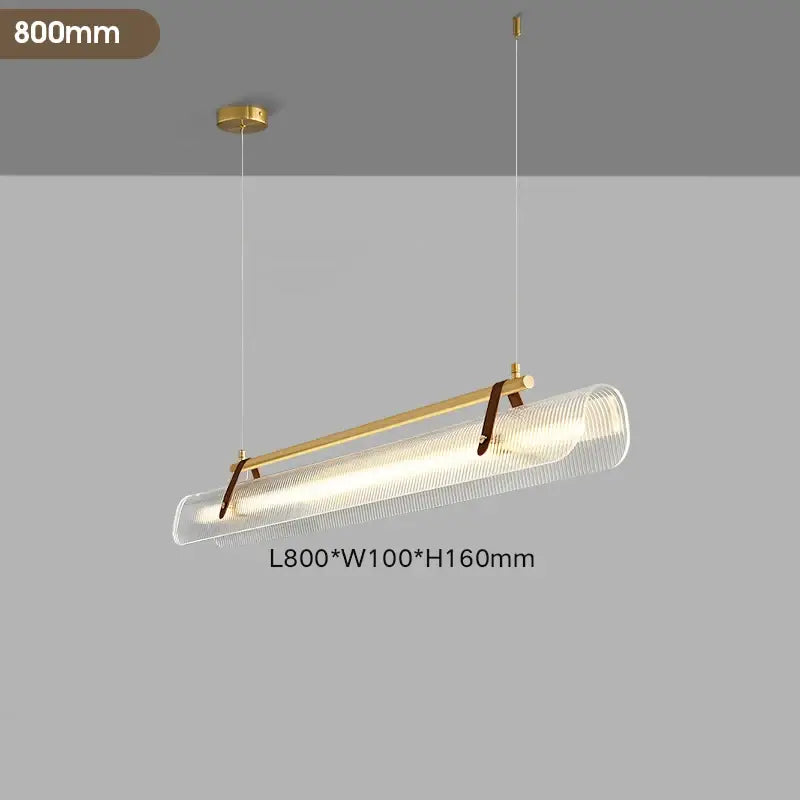 A modern decorbites led pendant lamp with gold metal frame, clear textured glass diffuser, and brown leather straps