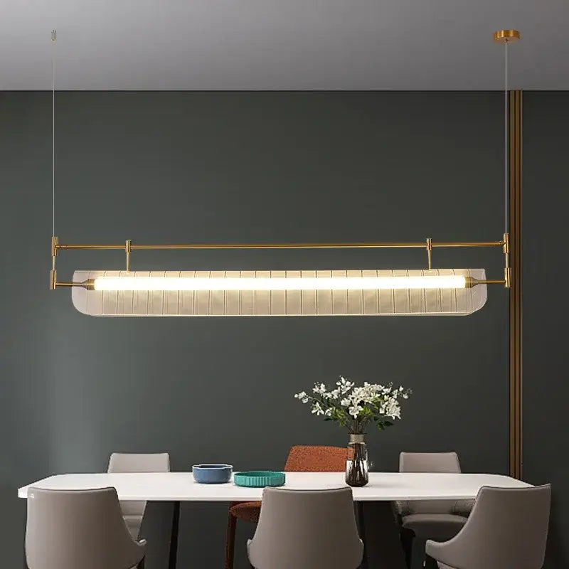 Modern gold-toned decorbites led pendant lamp with elongated rectangular design and diffused white light for dining room