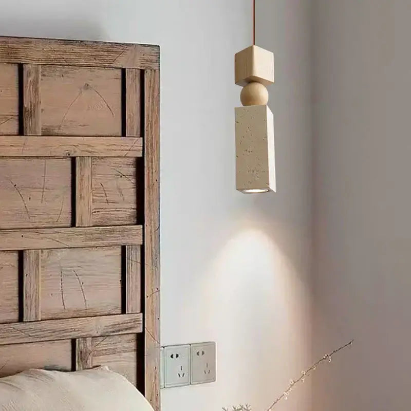 Minimalist decorbites led pendant light with stacked geometric shapes in yellow travertine wood and textured concrete