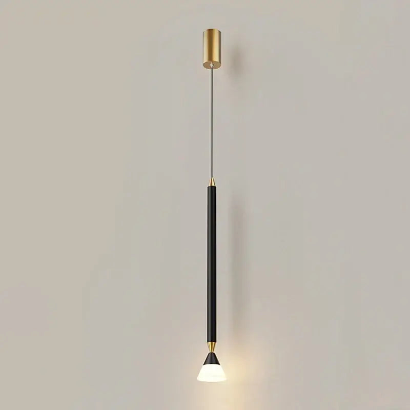 A sleek black and gold decorbites led pendant light with brass accents and warm glow for modern living and bedroom spaces