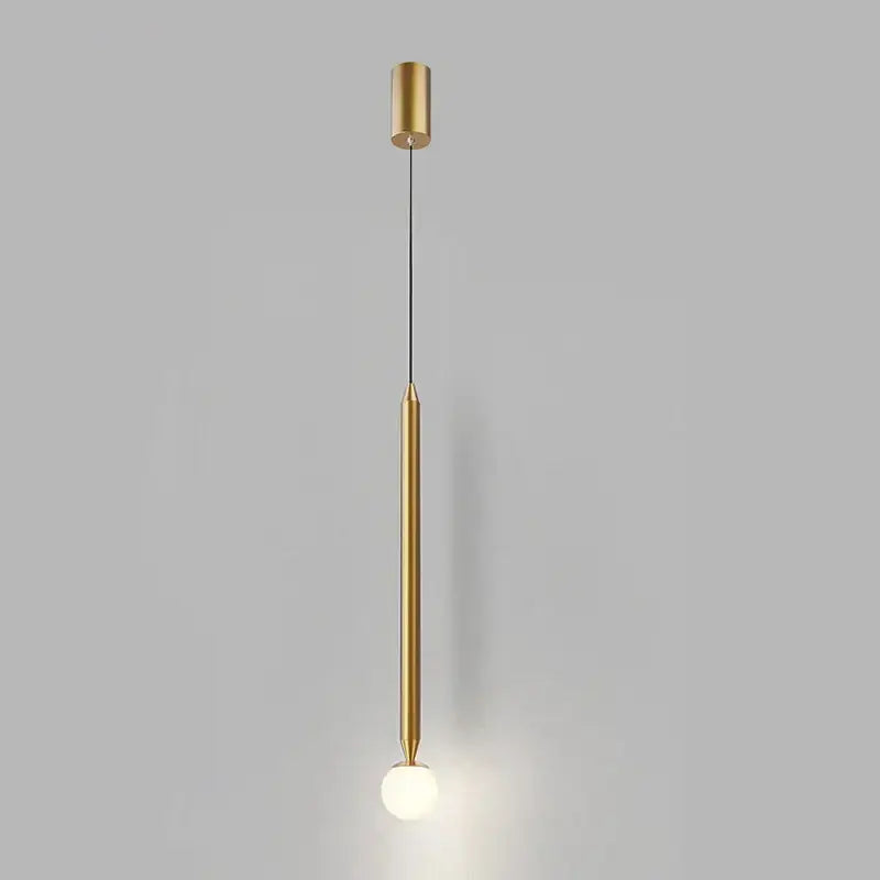 A sleek decorbites led pendant light with polished brass finish and frosted glass bulb for modern interiors