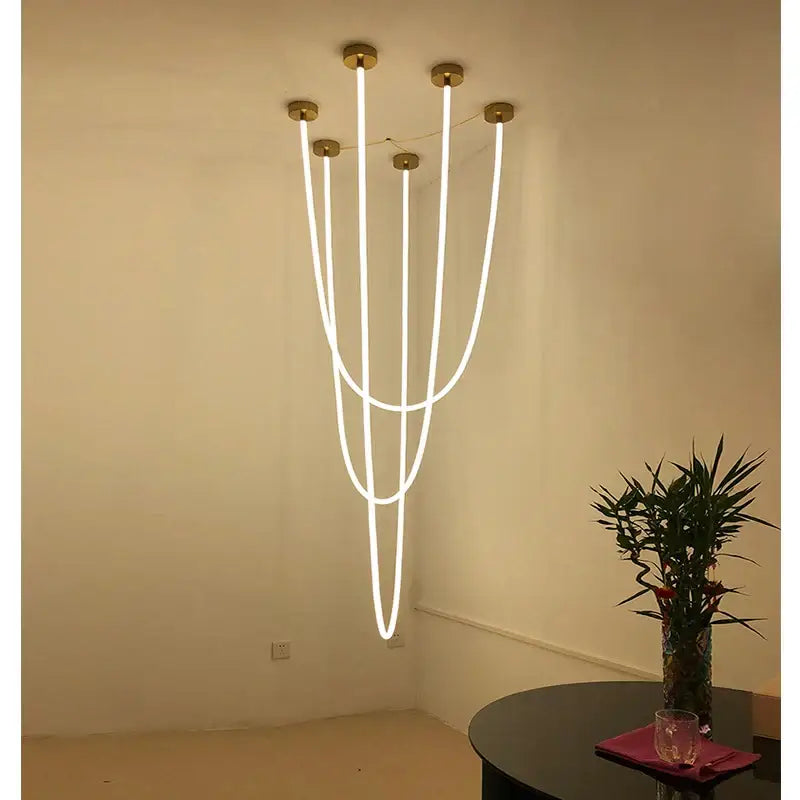 Modern minimalist brass decorbites led pendant lamp with five curved white led tubes for living and dining rooms